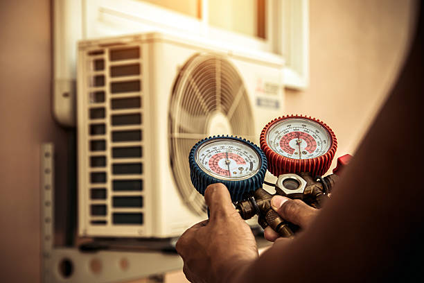 Professional Air Conditioning Service technician working in Southampton, NY